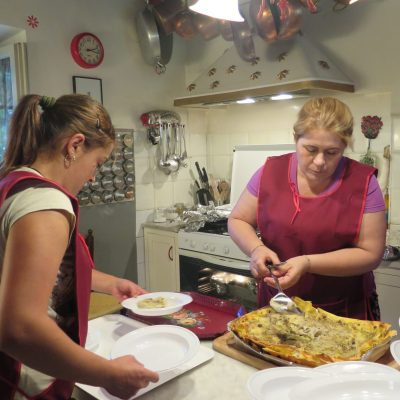 Tiziana and Giovanna cooking in the Kitchen